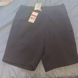 Selling Nike tech shorts large